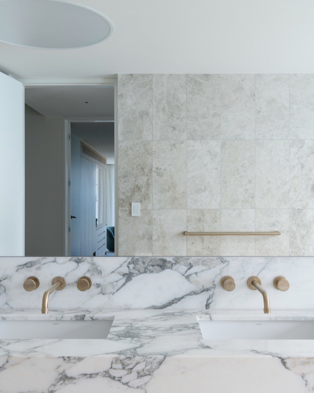 Marble vanity with brass tapware at Terrigal