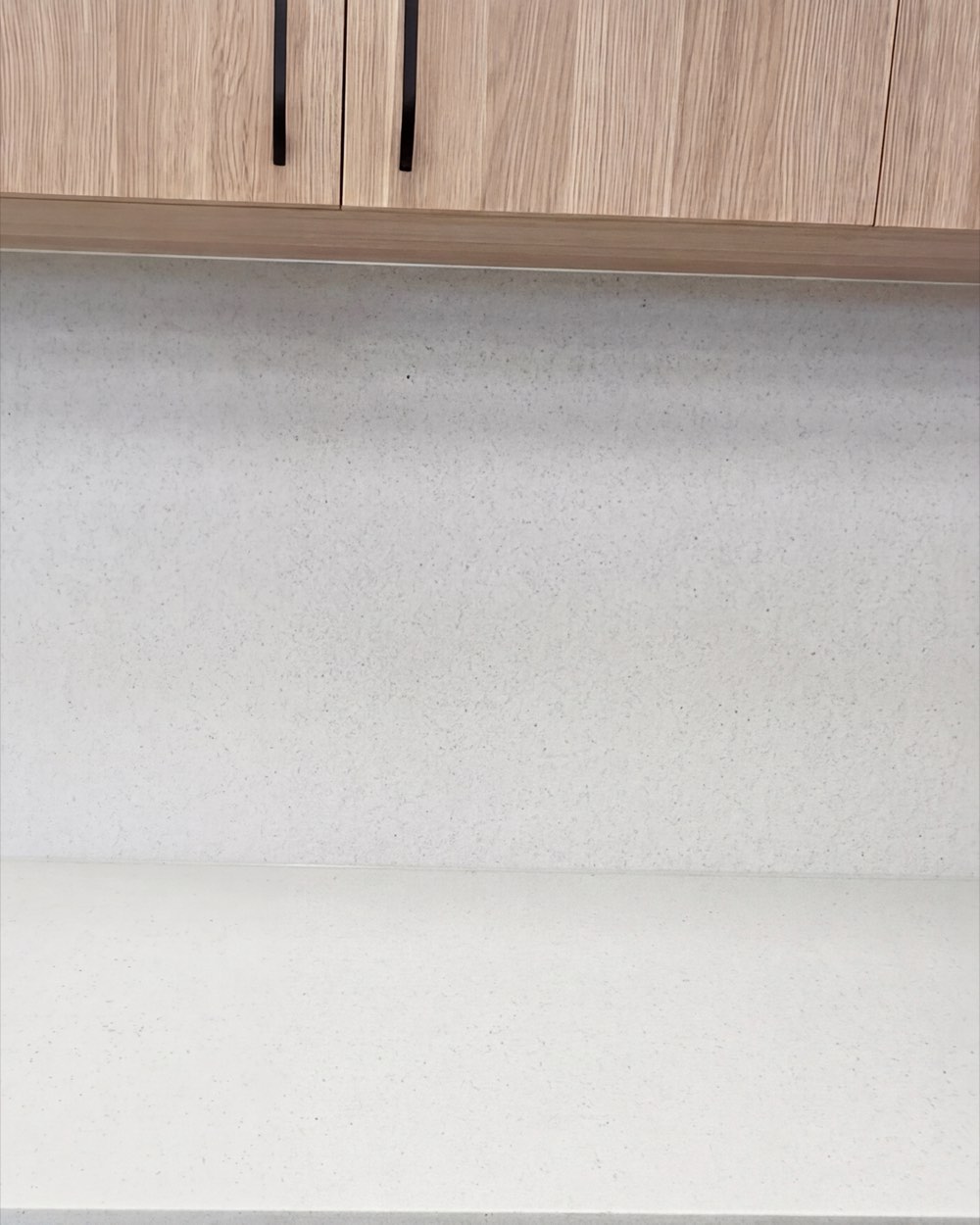 White counter with timber joinery in a Newcastle office fitout