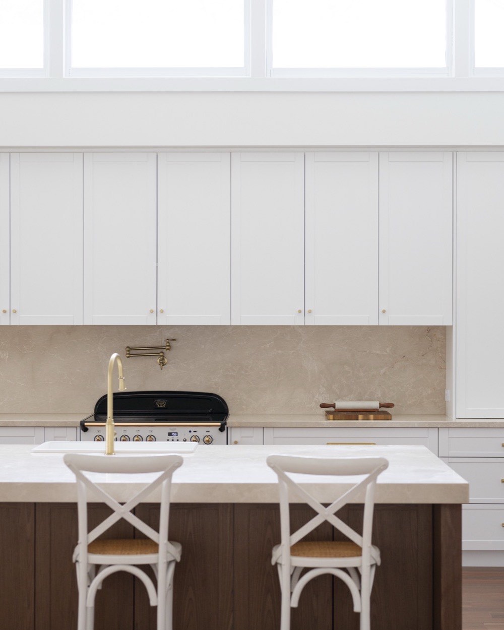 Stone island with bar stools in a Bolwarra kitchen